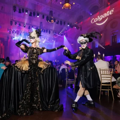 Two performers at Sydney Town Hall dressed with masks